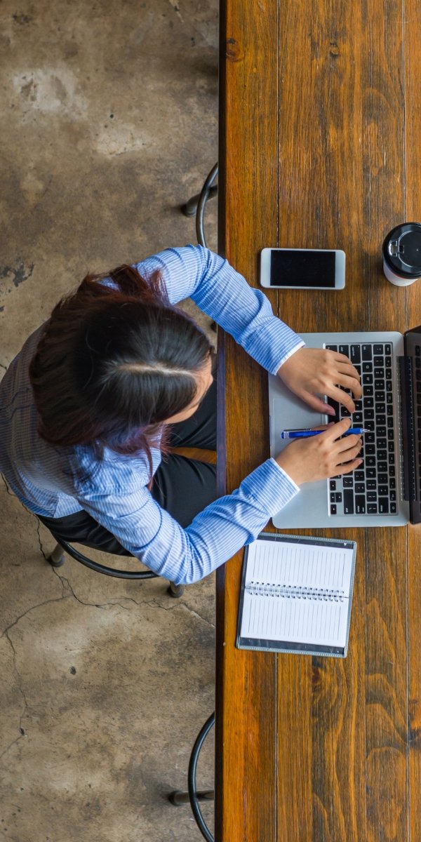 Person writing on laptop copywriter