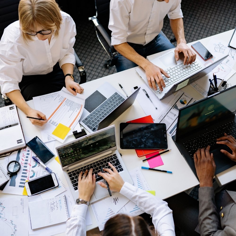 Manchester SMB team using AI automation tools to improve efficiency and reduce costs.