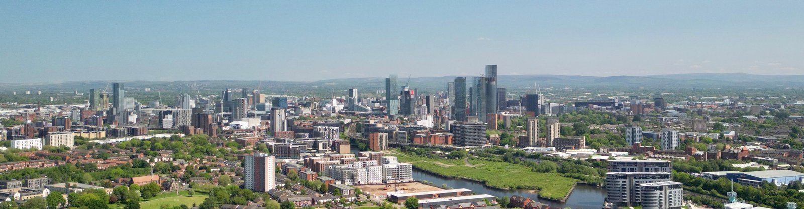 Manchester city skyline, representing AI automation for SMBs in Manchester.